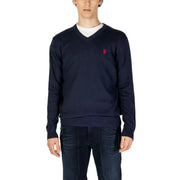Navy blue knitted v-neck sweater with small red embroidered logo on left chest from knitted clothing collection