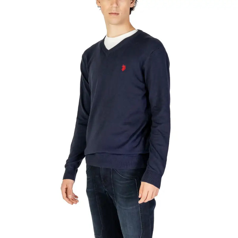 Navy blue knitted v neck sweater with small red embroidered logo on left chest from knitted clothing collection