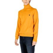 Mustard yellow turtleneck sweater with polo logo.