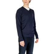 Navy blue v-neck sweater with a small embroidered logo on the left chest.