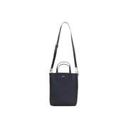 Lacoste black zip handbag tote bag with silver-tone hardware and contrasting white shoulder strap and inner pouch