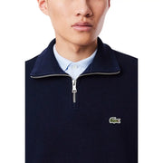 Sweat-shirt Lacoste pour homme, col roulé en coton bleu marine, demi-zip côtelé et fermeture éclair argentée avec logo crocodile vert.