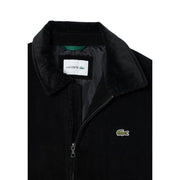 Blazer Lacoste pour homme en coton velours côtelé noir, orné du logo crocodile vert sur la poitrine et du col assorti.