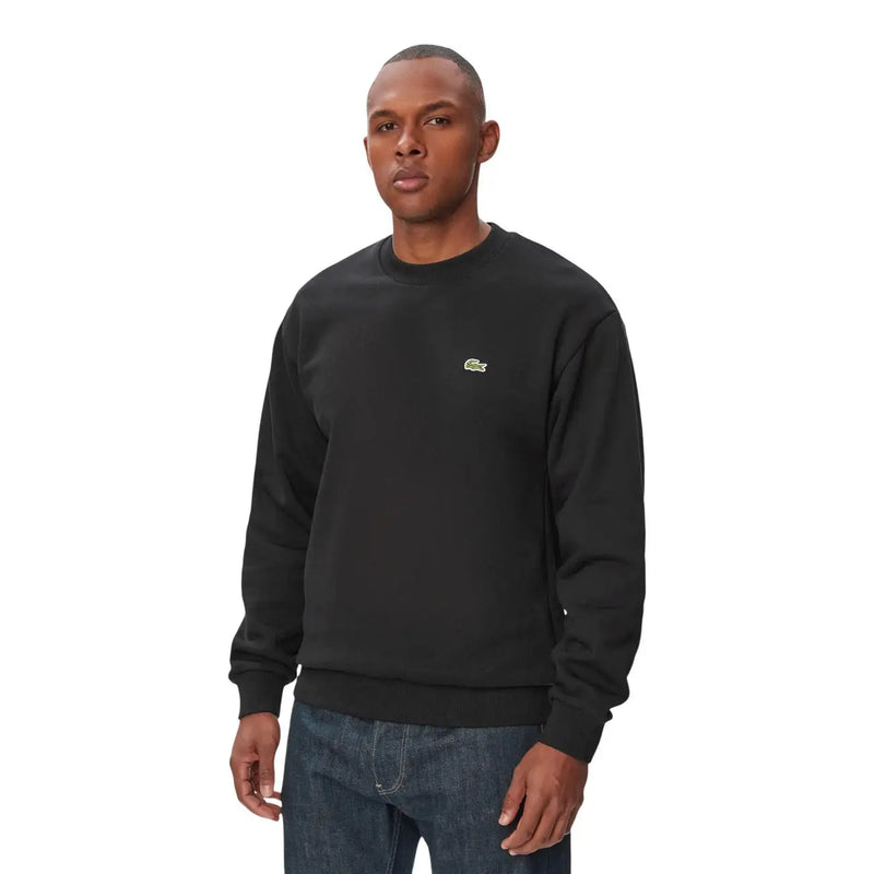 Sweat-shirt Lacoste noir pour homme, col rond en coton, avec petit logo crocodile vert sur la poitrine gauche.