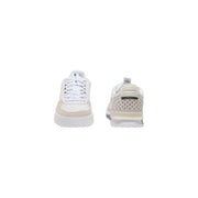 Baskets Lacoste Slam Break blanches et beiges en cuir pour homme, avec perforations et logo vert.
