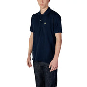 Polo Lacoste bleu marine pour homme, orné d'un petit logo crocodile vert, en coton bleu foncé à manches courtes.