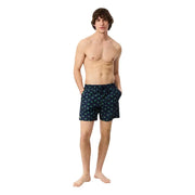 Dark blue Lacoste men swimwear swim trunks with a repeating pattern of small light green palm trees