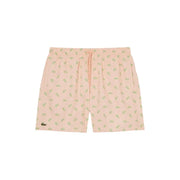 Pastel pink lacoste men swimwear shorts with light green crocodile pattern and elastic waistband with matching drawstring