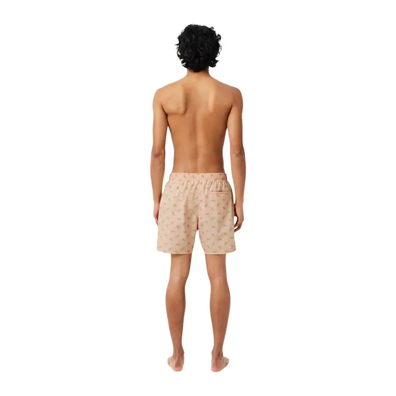 Beige Lacoste men swimwear swim trunks with subtle green leaf pattern and elastic waistband for comfortable wear