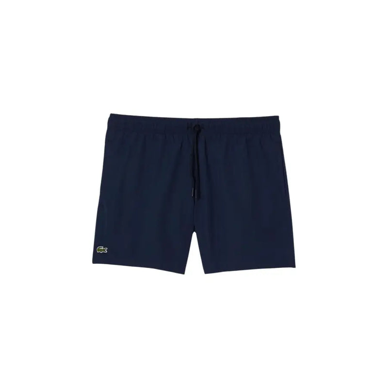 Navy blue Lacoste men swim trunks with subtle textured fabric and green crocodile logo on lower left leg