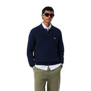 Pull Lacoste en laine bleu marine pour homme, orné du logo crocodile vert sur la poitrine gauche, vue de face