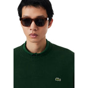 Lunettes de soleil Lacoste pour homme, monture écaille marron foncé et verres noirs, vue de face
