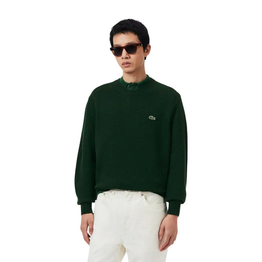 Pull Lacoste en laine vert foncé pour homme, orné d'un logo crocodile brodé sur la poitrine gauche (vue de face).