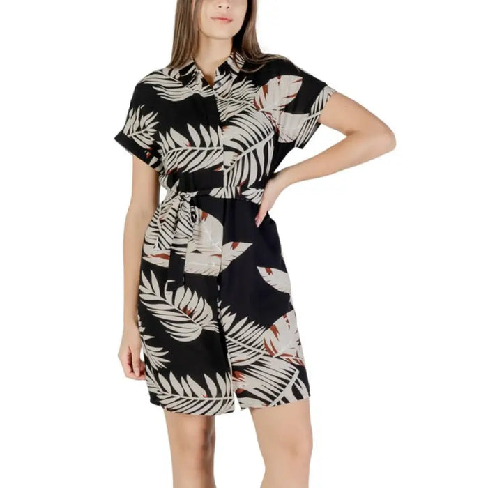 Leaf-patterned button-down romper displayed on Women’s Leaf Patterned Romper and Shirt Dress
