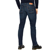 Dark blue levi’s 512 slim fit jeans with red stitching and yellow patch on back pocket.