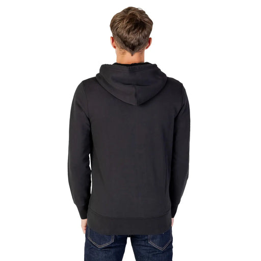 Sweat à capuche zippé Levi's pour homme, en coton noir doux et lisse, avec poignets et ourlet côtelés.