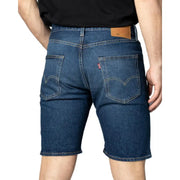 Back view of dark blue cotton denim Levi’s men’s shorts with classic brand patch and red tab on the pocket