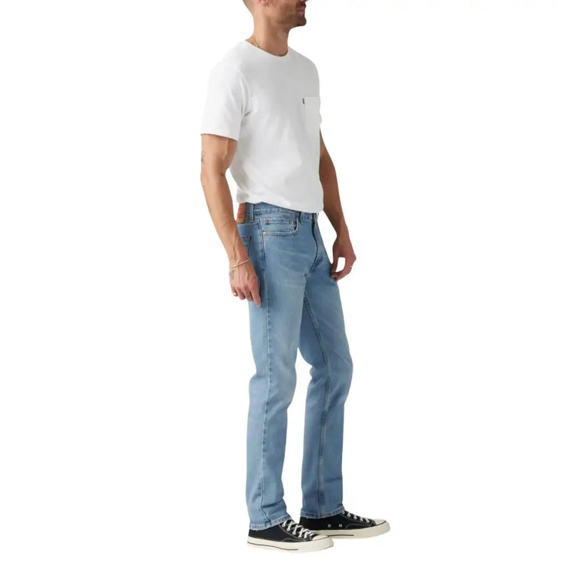 Light blue denim jeans with a classic straight leg fit and white stitching, possibly from levi’s 501 model.