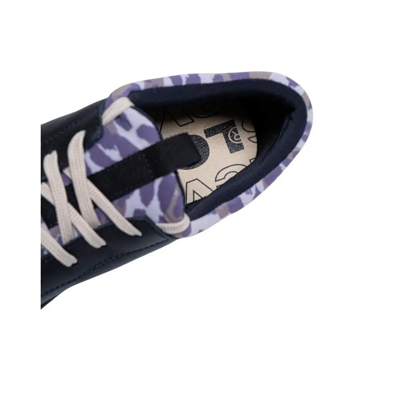Levis women’s black leather sneakers featuring navy blue and purple leopard print with white laces
