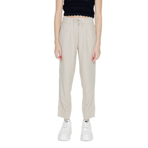 Light beige linen viscose trousers with pleated front, drawstring waist, and pockets