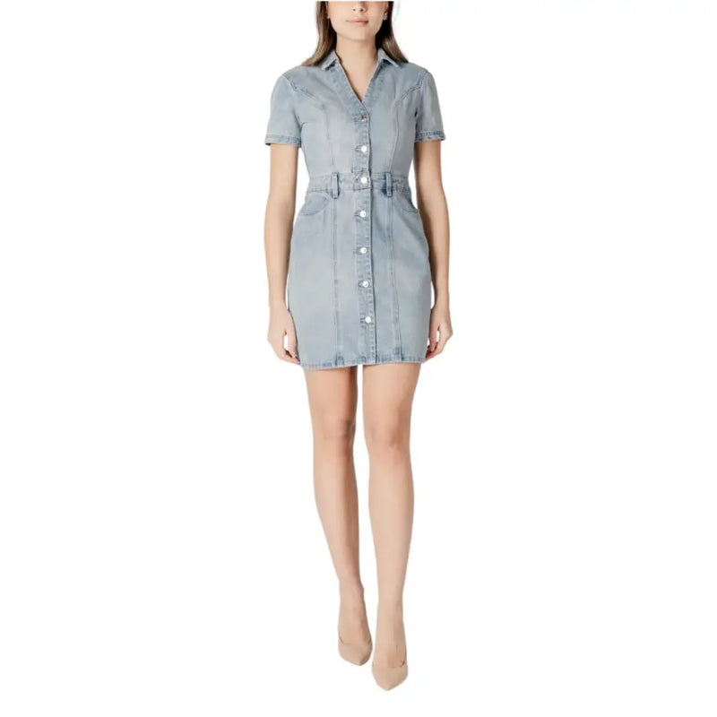 Light blue cotton button front dress with v neck, short sleeves, fitted waistband, and pockets in light-wash denim