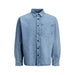 Light blue denim shirt displayed with casual denim jacket and dark jeans