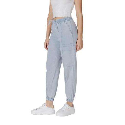 Light blue drawstring jogger pants displayed in a product listing