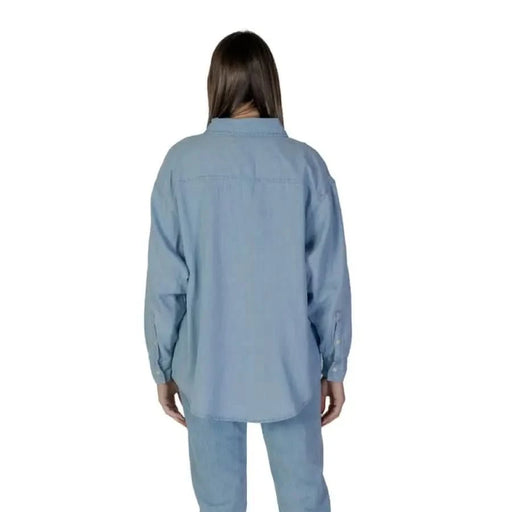 Light blue long-sleeved button-up shirt displayed from behind, Calvin Klein Jeans