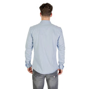 Light blue long sleeved dress shirt with classic collar and buttoned cuffs made of soft breathable fabric