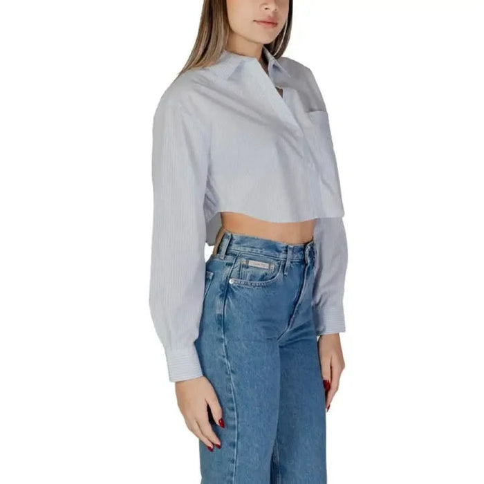 Light blue striped cropped button-up shirt with long sleeves by Calvin Klein Jeans