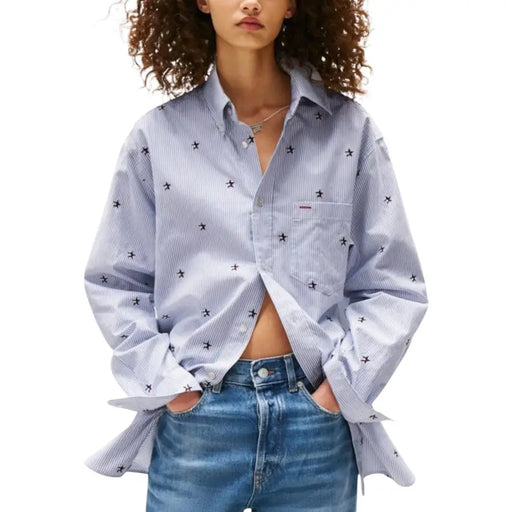 Light blue and white pinstriped organic cotton long sleeve shirt with black airplane embroidery