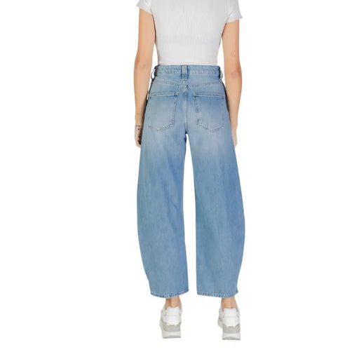 Light-wash wide-leg high-waist denim jeans with zip, button, and pockets for women
