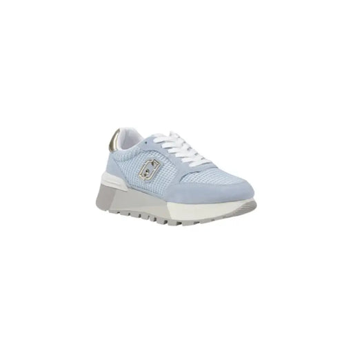 Light blue women’s sneaker with silver accents displayed in the product image