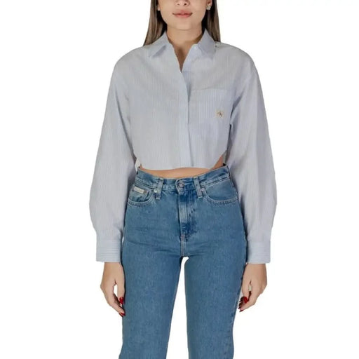 Light gray long sleeve button-down shirt with blue jeans from Calvin Klein Jeans