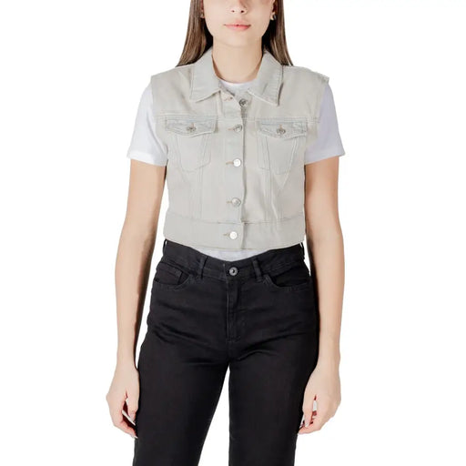 Light gray denim vest with classic collar front button closure and two chest pockets in a casual style