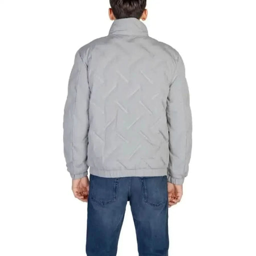 Light gray quilted Antony Morato jacket with high collar over blue jeans