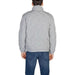 Light gray quilted Antony Morato jacket with high collar over blue jeans