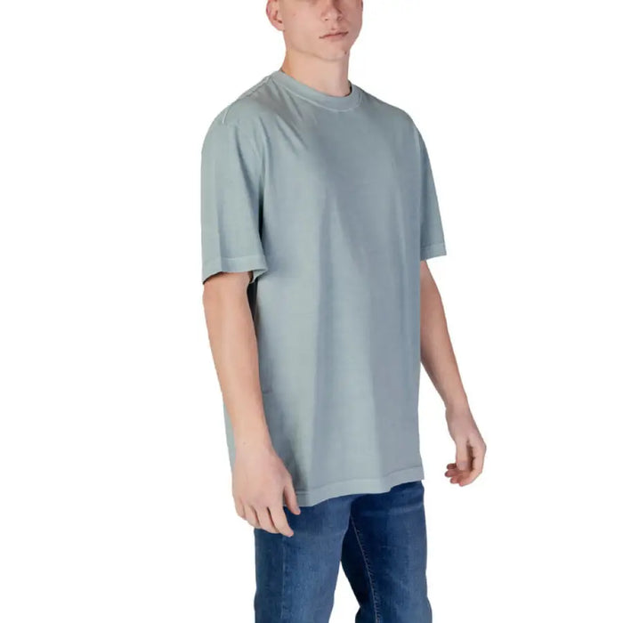 Light green Calvin Klein Jeans Men’s Printed T Shirt displayed on a neutral background
