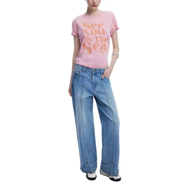 Light pink Desigual Women T-Shirt with rolled sleeves paired with light wash wide-leg jeans