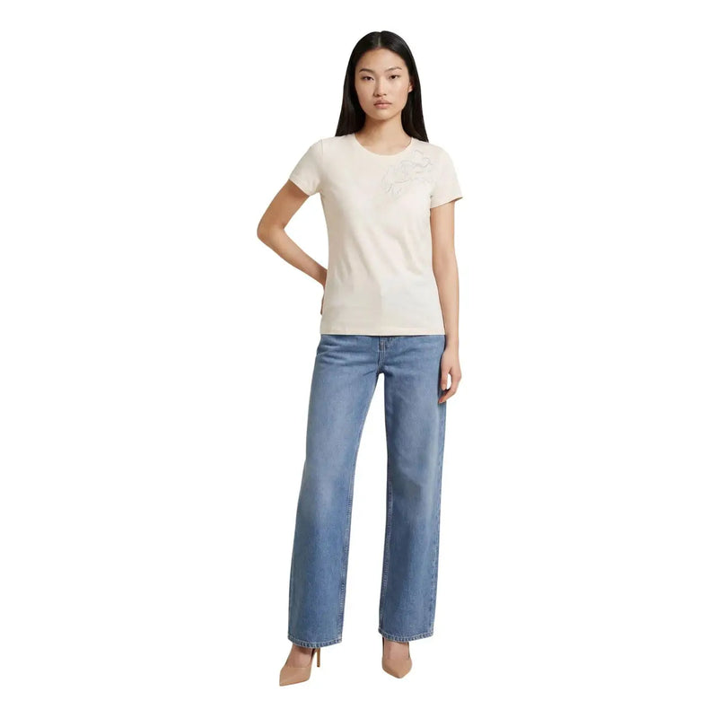 A woman wearing a liu jo women beige cotton round neck short t shirt with embroidered logo and light-wash jeans