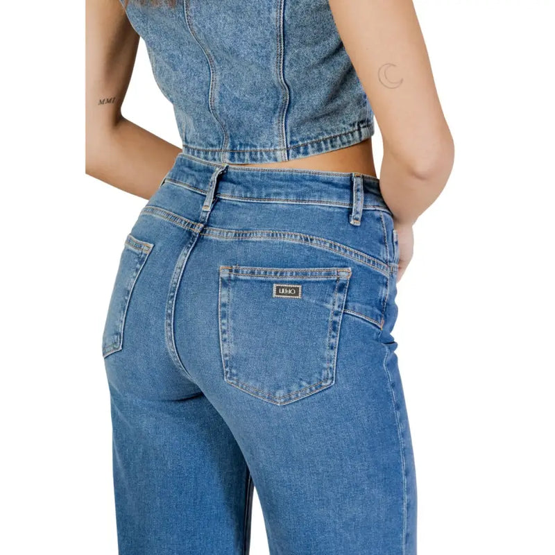 Blue denim jeans with classic back pocket design and small black brand label made of cotton elastane by liu jo