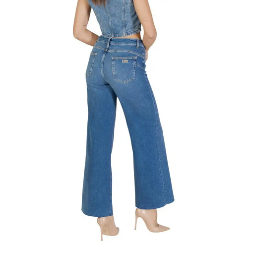Blue denim wide-leg cotton elastane jeans with five-pocket design and brand patch on back right pocket by liu jo