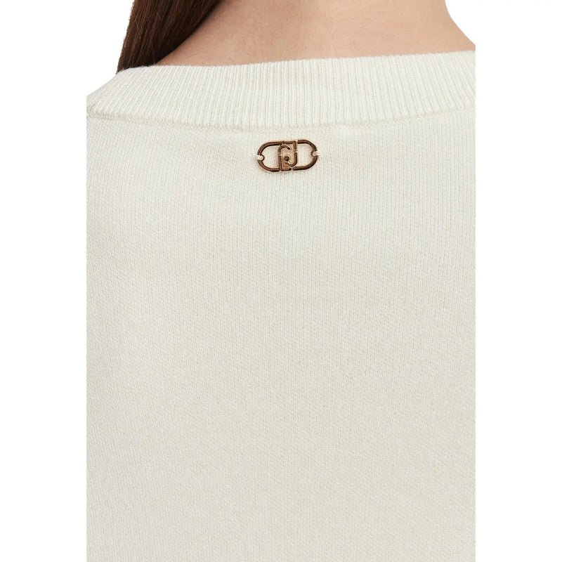 A gold-tone metal logo pin on the back of a liu jo women white floral wool blend ribbed knit sweater