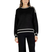 Woman wearing Liu Jo White Long Round Neck Knit Sweater with black trim and shoulder details