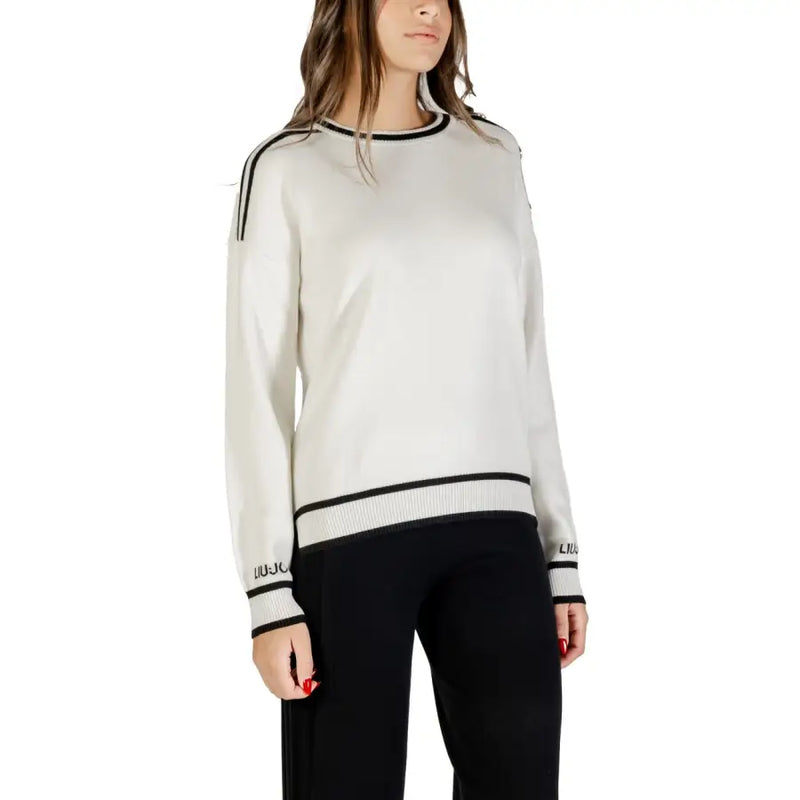 Women’s white long-sleeved knit sweater with black trim and round neckline by Liu Jo