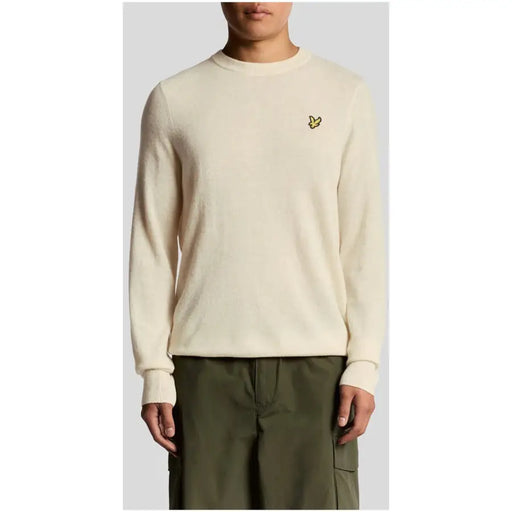 Cream-colored lyle and scott wool blend crewneck sweater with yellow bird logo on left chest in beige marl finish