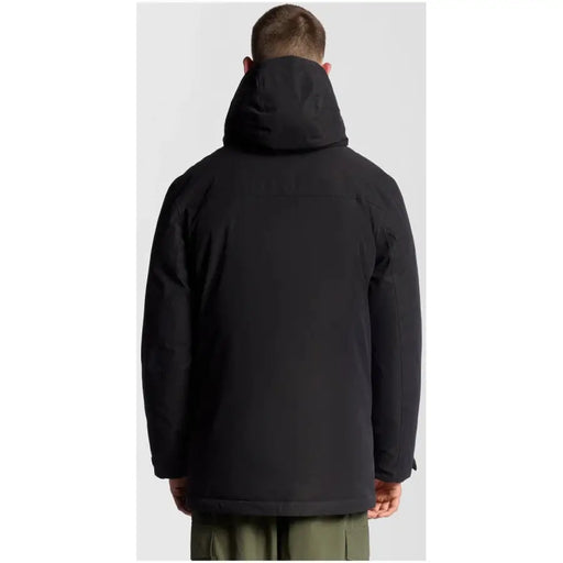 Black waterproof jacket with hood and zipper closure, likely from a popular outdoor brand.