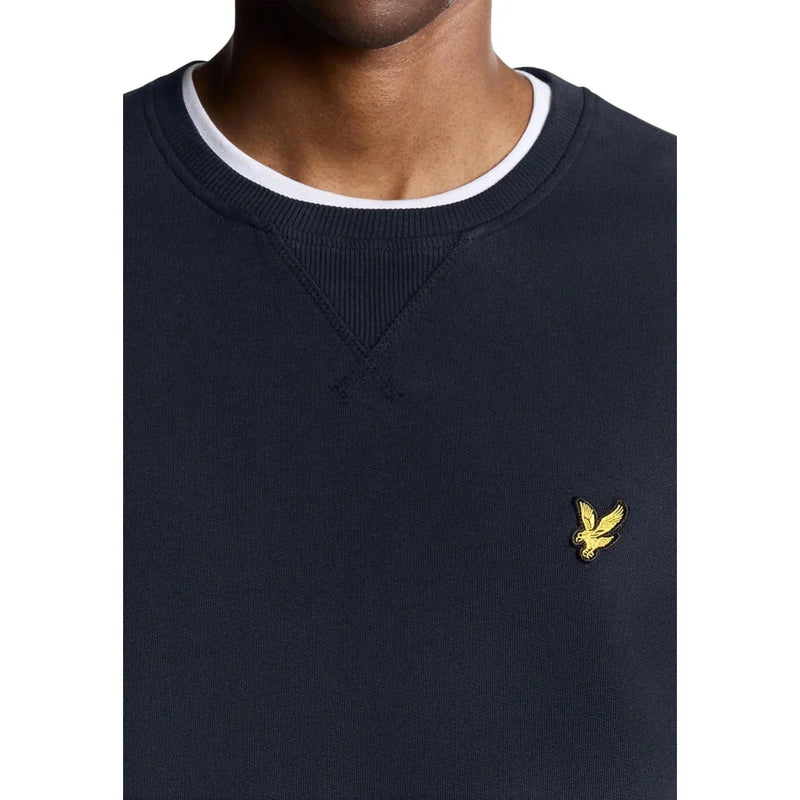 Sweat-shirt homme Lyle And Scott bleu marine en coton, col rond, bordures côtelées blanches et logo oiseau brodé jaune.