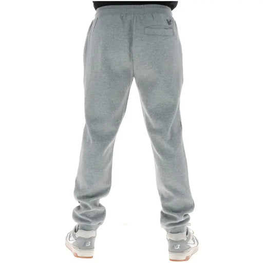 Lyle & Scott Pantalon de survêtement gris chiné pour homme, avec taille élastiquée à cordon et logo brodé sur la poche arrière.