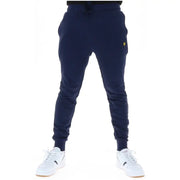 Pantalon de jogging en polaire bleu marine avec un petit logo oiseau jaune sur la cuisse, idéal pour un style décontracté. Lyle & Scott